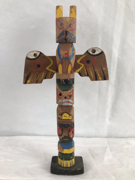 Souvenir Totem Hand Carved 10.25": Paint loss throughout. Colored in yellow, red, black, white, green, grey, blue and brown. 10.25h inches