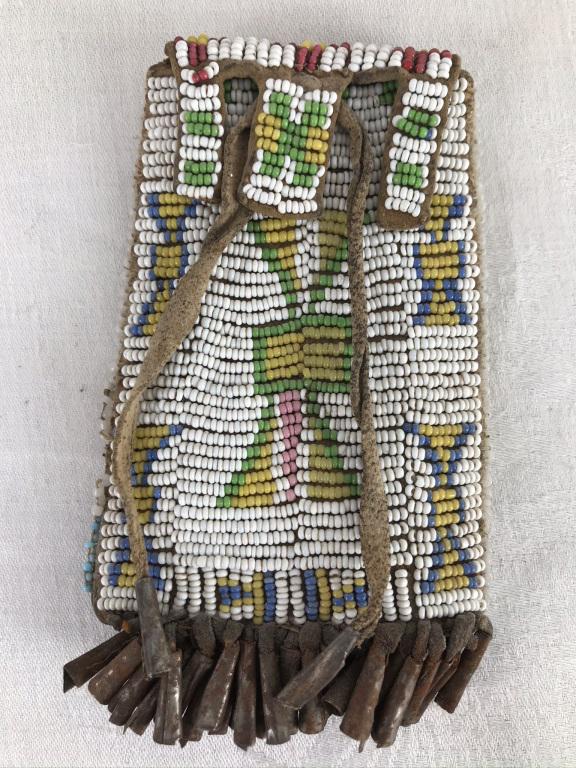 Beaded Native American Strike-a-Lite Case: White, Green Yellow, Blue & red beads. Flat metal rolled into cylinders and held by leather strips to form a fringe. 5h x 3w inches.