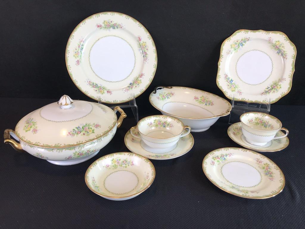 99 Piece Noritake Dinnerware Set: 11 dinner plates 10"d., 12 luncheon square plates 8"d., 12 tea cups and saucers, 12 cream soup and saucers, 12 bread and butter plates 6.25" d. One of each: gravy boat, platter 16", platter 12" covere