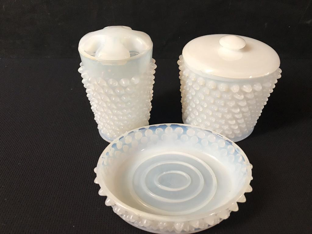 Opalescent Hobnail Bathroom Set, Vintage: Toothbrush 5h inches, Jar with lid 4h inches and soap dish is 5.75w inches. Jar as a hairline crack in bottom, but very usable.