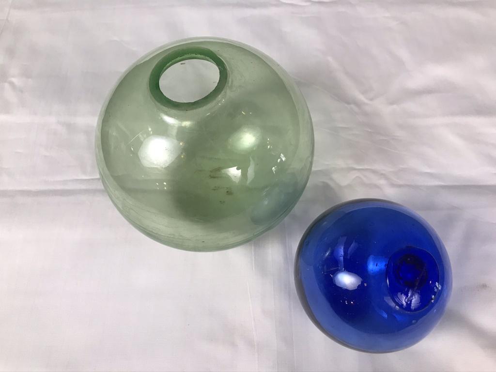 Glass Balls Blue and Vaseline Green Glass: 3" and 4.5" diameters. Green has a hole at one end. Blue is sealed.