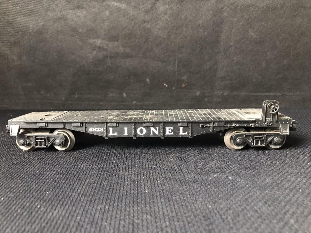 Lionel Flat Car: 6828 Black Small melt marks from tires of P&H Crane; no load