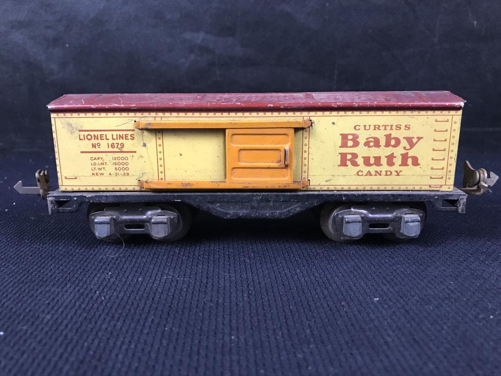 Lionel Box car, Baby Ruth: 1679 Maroon roof, orange doors and door guides. Missing one door and door guides on one side. No Baby Ruth Logo