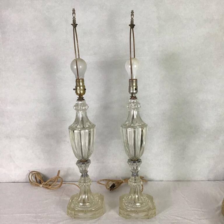 Pair of Clear Glass Lamps: 28" high to top of harp. Note: This lot can not be shipped in house. Buyer must arrange shipping for this item or pick up this lot.