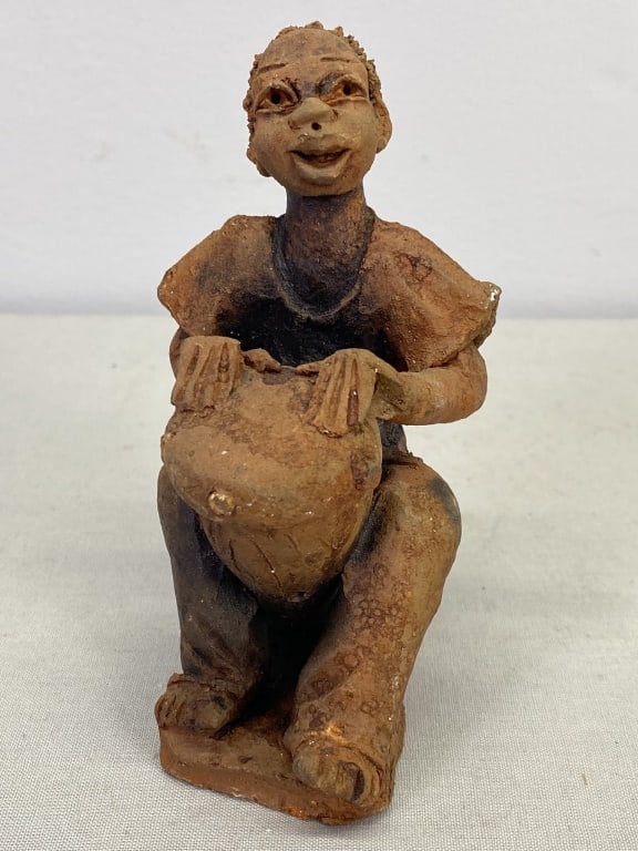Clay African Figure: 45.5"h x 3"w x 2"d. 7 oz.
