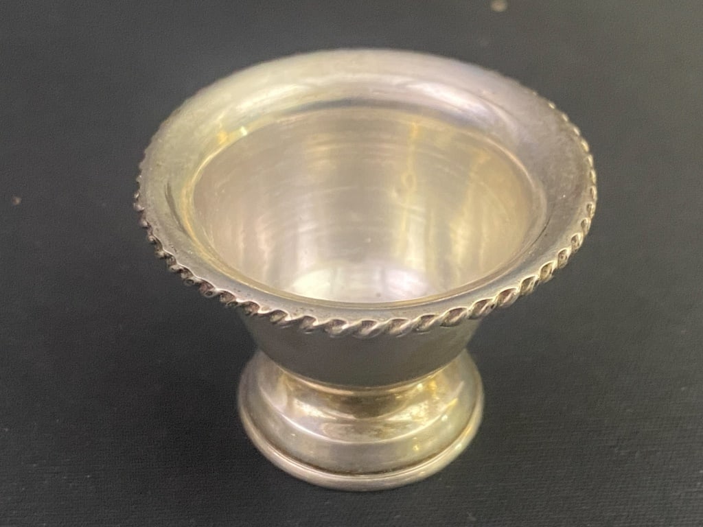 Sterling Salt Cellar: 1 1/8"h x 1.75"w. 12 grams. Dent at base.