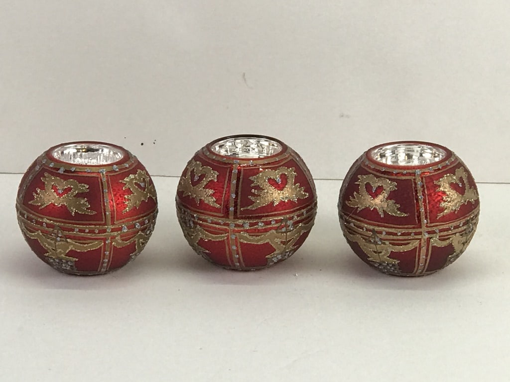 3 Red Votive Holders: Glass. 5"d x 5"w x 7.5"h in box. 7.1 oz total
