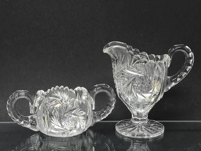 Creamer & Sugar American Brilliant Cut Glass: Creamer & Sugar, American Brilliant Cut glass. Pinwheel pattern. Creamer 5"h x 5"w x 3"d. Sugar 6h x 3w x 2.5d. 2 lbs. 3 oz.