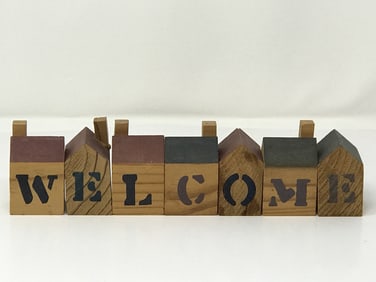 House Shaped Wood Blocks Spell: "Welcome"