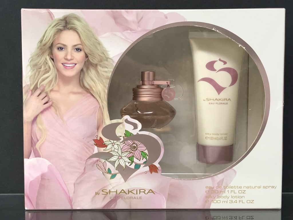 Shakira Eau de Toilette Spray & Body Lotion: Shakira Eau de Toilette Spray and Body Lotion 3.4 fl. oz. 8"h x 10.25"w x 3"d. box 11.8 oz.