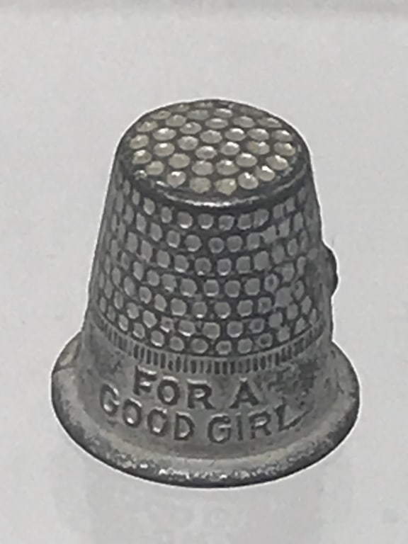 "For A Good Girl" Monopoly Thimble Game Piece: "For A Good Girl" Monopoly Thimble Game Piece. 1st half of 20th Century. 9/16"h. 1 oz.