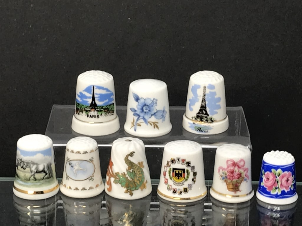Thimbles From International Cities (9): 9 International Cities: Paris (2), Limoges, Avignon, France. Bundesrepublik, Kleiber, Vohenstrauss, Hutschenreuther, Scherzer and Krister, Germany. 3/4" - 1"h. 1.7 oz.