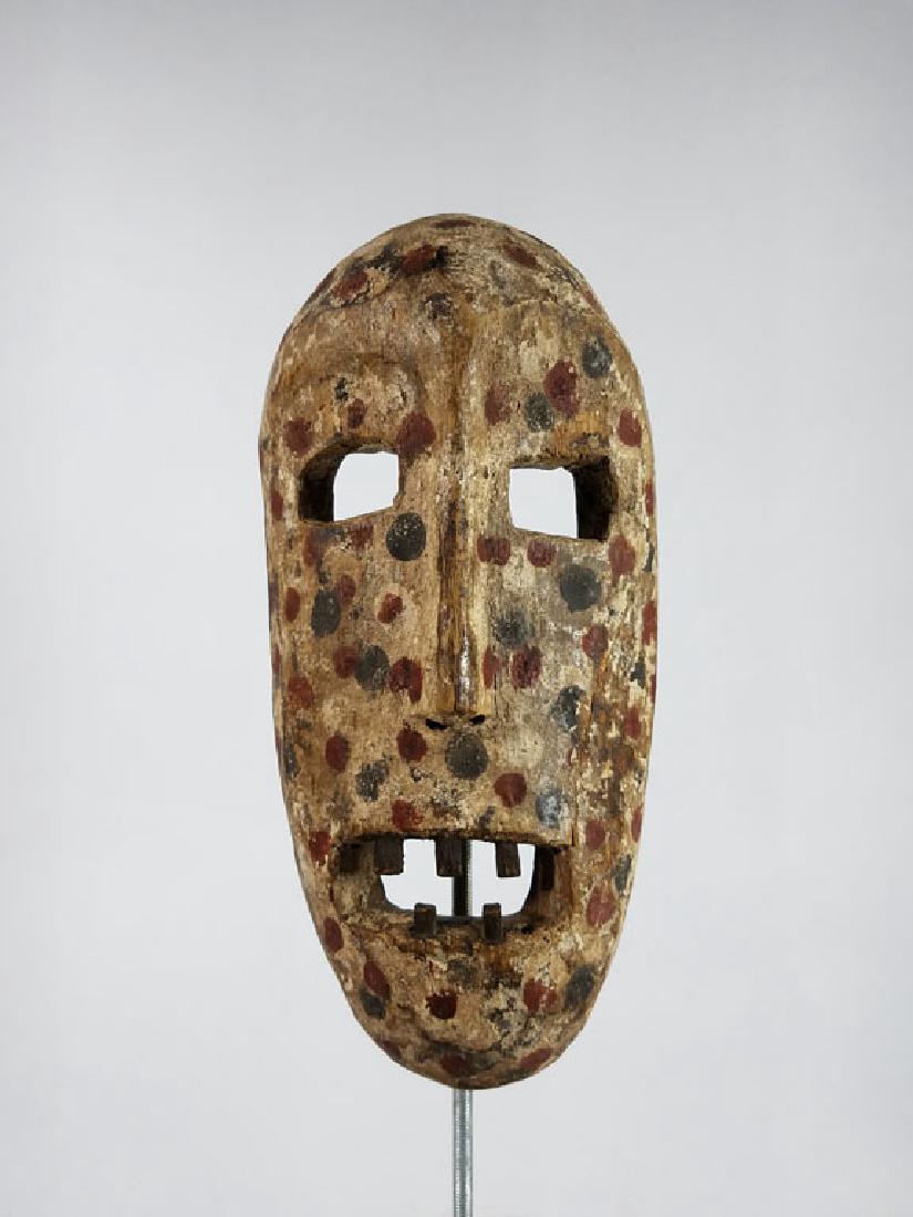 Antique Zaire Polychrome Dot Mask: African Art: Nice patina and polychrome decoration. Zaire origin but tribe is unknown. Signs of ritual use and wear. Great patina.11x3x5.5"