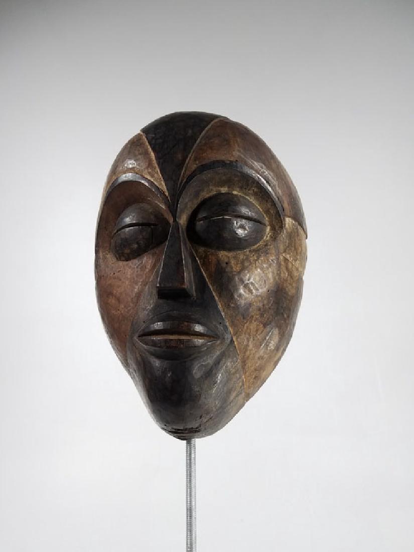 Gabon Antique Dance Mask: African Art: Well carved, heavy dance mask with reddish patina and polychrome decoration. Quality old piece. Round eyes and thin lips.9x7x5"