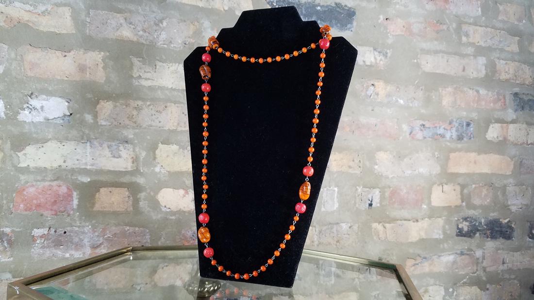 Art Deco Czech Flapper Beads: Stunning tricolor extra long flapper blown glass beaded necklace. Five striped barrel beads. Luminescent orange beading 22in. total length.