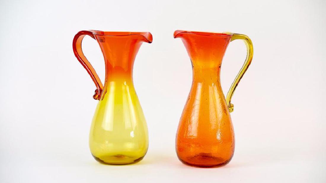 Pair of Blenko #569 L Pitchers: Pair of Blenko #569 L Pitchers. Both Tangerine, One Crackel Size: 12.5" x 5"