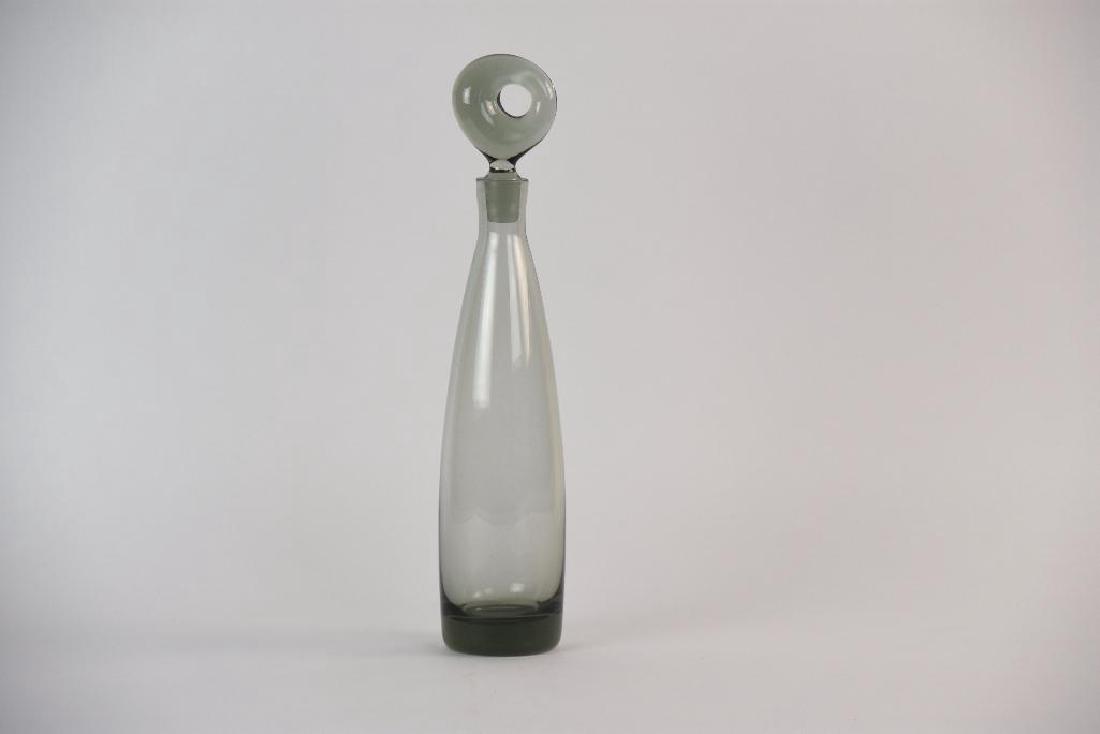 Per Lutken Blown Glass Decanter Aristokrat for: 1950s Per Lutken Blown Glass Decanter Aristokrat for Holmegaard. Grey in color. Size: 14.5" x 3"