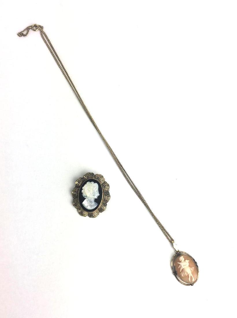 Lot of 2 Gold Filled Cameos: Lot of 2 Gold Filled Cameos. 1 x Shell Cameo Pendant Stamped 12K GF, Total Weight 5.3g, Approx Chain Length 9" 1 x Mother of Pearl and Marcasite Cameo Brooch Pin, Stamped 12K GF, Total Weight 7.5