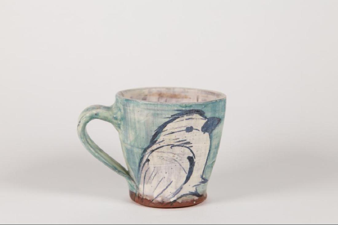 Scott Lykens (American) Hand Painted Bird on Hand: Scott Lykens (American) hand painted bird on hand thrown cup. Clear glaze on exterior and interior of cup. Good condition.5"D x 3 1/2"H