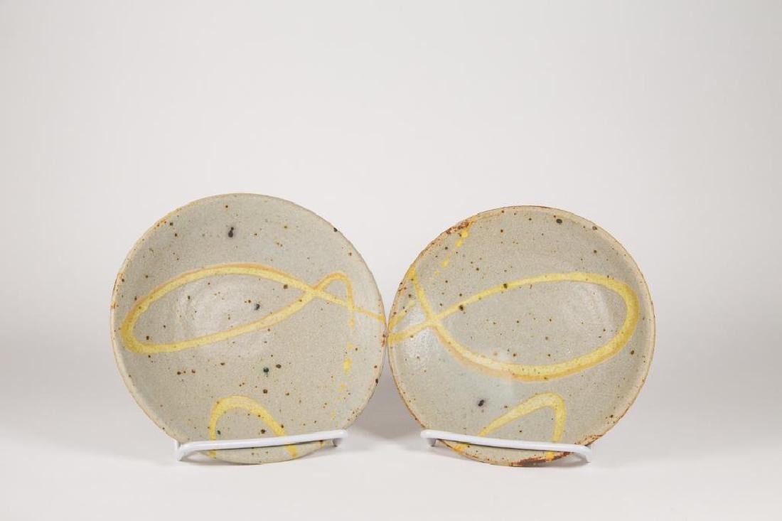 Warren MacKenzie (American 1924-2018) Pair of Shallow: Warren MacKenzie (American 1924-2018) Pair of shallow bowls with yellow line modern design. Mackenzie signature stamp on both bowls. Good condition. 7"D x 1 1/2"H