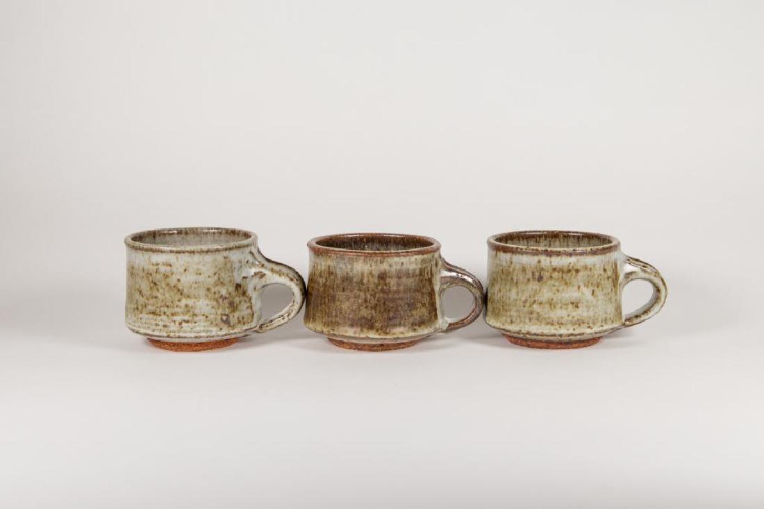 Vivika Heino (1910-1995; USA) and Otto Heino (1915-2009;: Vivika Heino (1910-1995; USA) and Otto Heino (1915-2009; USA) Set of Three (3) Stoneware Cups. Stoneware is the color of dark chocolate, and the glaze is more of a medium brown and gray with a speckle