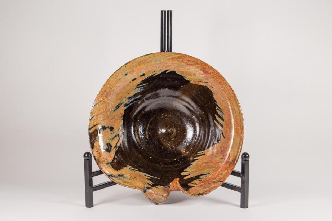 Attr. to Marie Woo Ceramic Bowl: Attr. to Marie Woo Ceramic Bowl with Marie Woo signature torn edge. Interior black glaze with brown glazed rim. Good condition. Signature and date on bottom. 10"D x 3"H