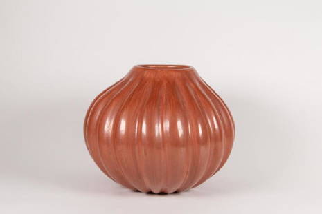 Helen Shupla (1928-1985) Santa Clara Redware Melon Jar: Helen Shupla (1928-1985) Santa Clara Redware Melon Jar. Redware glaze with lobed form tapering toward the rim, signed "Helen Shupla Santa Clara Pue,". Good condition. 7"D x 7"H