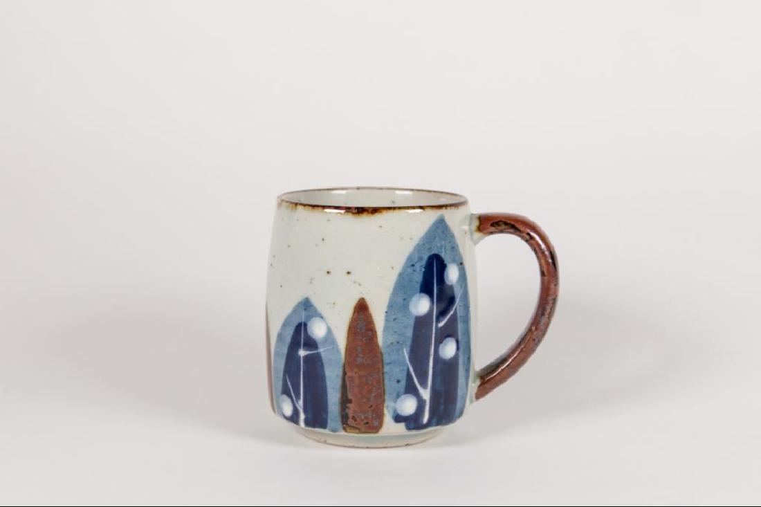 Otagiri Style Stoneware Coffee Mug: Otagiri style stoneware coffee mug. Blue and brown leaf design with brown handle. Good condition. 4 1/2"D x 4"H