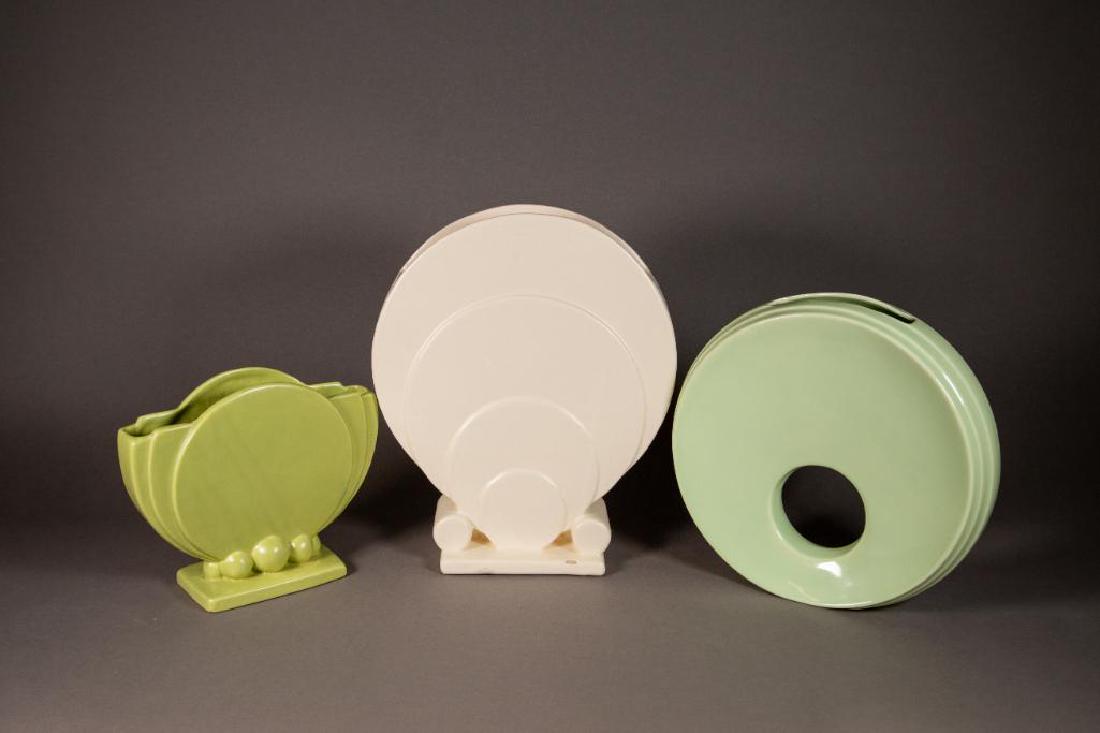 Lot of G. McStay Jackson Art Deco Style Vases: Lot of McStay Jackson Art Deco style vases. Three (3) different styles Art Deco vases. White round arches on vase with square bottom. Good condition. 9 1/2" W x 4"D x 12"H Seafoam green doughnut hole 