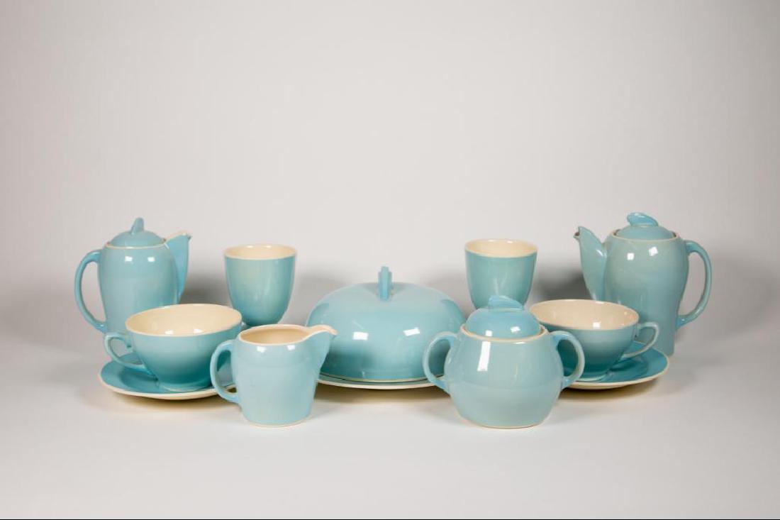 Susie Cooper (1902 -1995) Blue Breakfast Ceramic Set: Susie Cooper (1902-1995) blue breakfast ceramic set. Exterior is glazed periwinkle blue. Interior is glazed cream. Set contains two (2) cups, two (2) hot water or coffee pots, one (1) muffin warmer, t