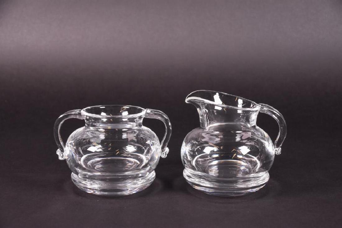 Steuben Crystal Creamer and Sugar Bowl: Steuben Crystal Creamer Pitcher and Sugar Bowl. Comes with two (2) coasters. 3 1/2" Width 3"Height. Signed on bottom.
