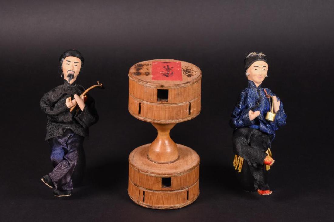 19th C. Chinese Wooden Yo-Yo and Two Chinese Figurines: 19th C. Chinese Wooden Yo-Yo with character marks and paper label. The Chinese yo-yo (_Š¿_šÇ : chÛ_ lí_ng) is a toy from China found dating back to the Ming dynasty; roughly 1386-1644 A.D. The C