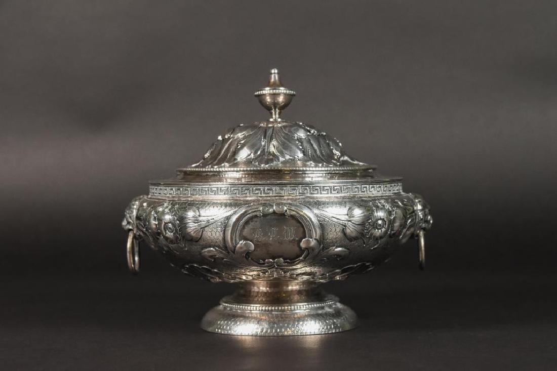 19th C. Tiffany & Co. Silver Repousse Covered Bowl: Marked Tiffany & Co. Gold & Silversmiths 550 Broadway. 377, 2915. Lion head bail handles. Floral and acanthus leaf decoration. Monogrammed R.L.W. June 24, 1858. Measures 6"Diameter; 5 1/2 Heig