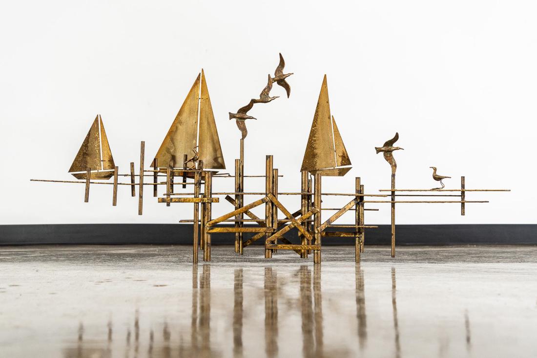 Curtis Jere Brass Sailboat Wall Art: Curtis Jere Brass Sailboat Wall Art. CONDITION: Good/Fair. CONDITION REPORT: Has been resoldered in multiple places on back. Refer to photos for condition. MEASUREMENTS: H 22in. x W 49in.