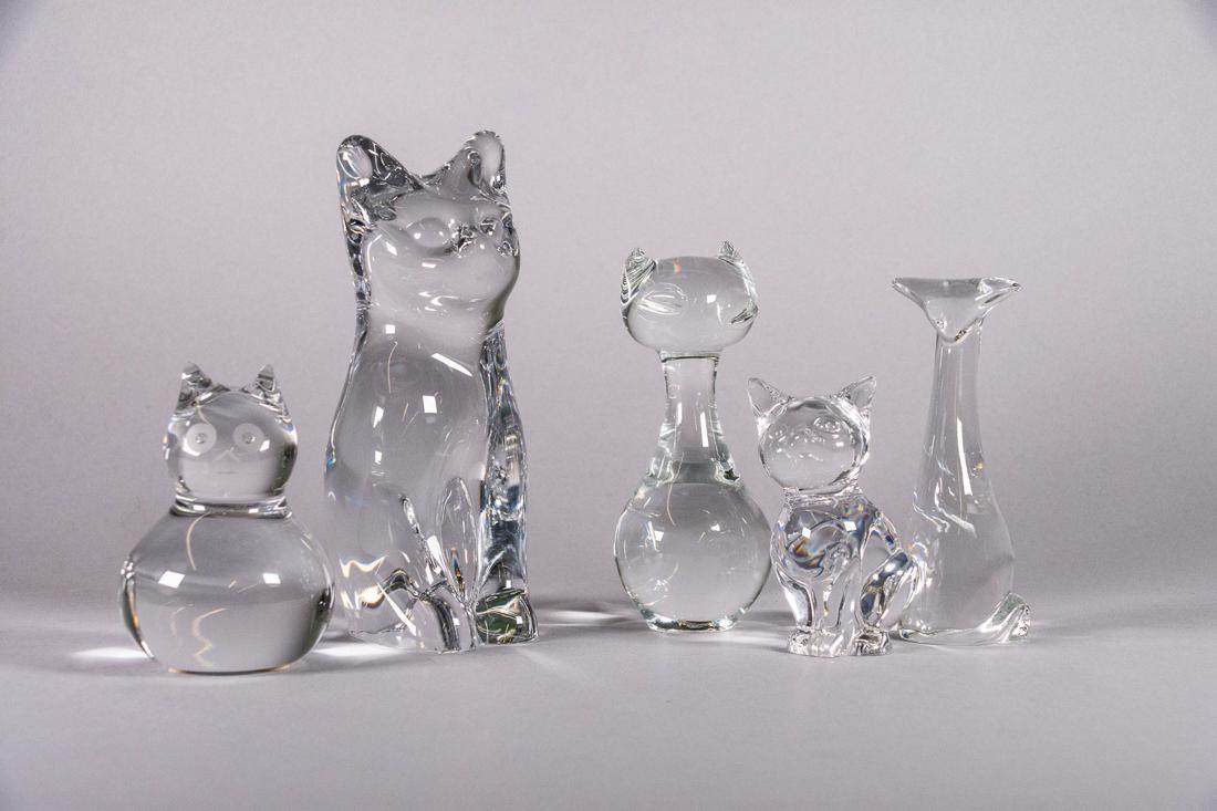 Daum and Baccarat Crystal Cat Collection: Baccarat and Daum crystal cat collection. This collection consist of two (2) Daum and two (2) Baccarat and one unmarked cat. CONDITION: Good. Refer to photos.MEASUREMENTS: Tallest cat is H 6.5in. Smal