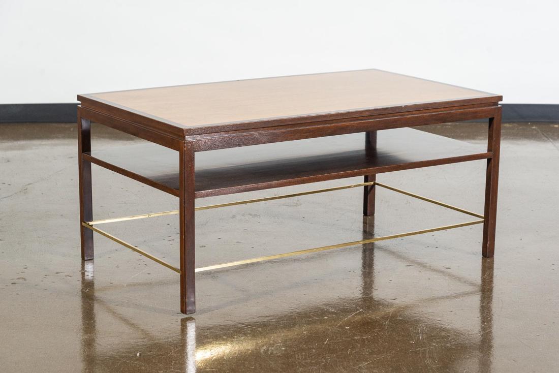 Dunbar Coffee Table Designed by Edward Wormley: A very handsome cocktail or coffee table designed by Edward Wormley for Dunbar. This example has a walnut veneered top that's banded with mahogany. Dunbar metal tag is attached below middle shelf. PLA