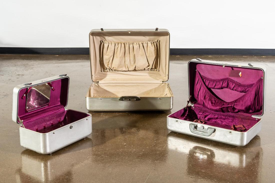 Zero Halliburton Three (3) Pc. Aluminum Luggage Set: Vintage Zero Halliburton Three (3) Pc. Aluminum Luggage Set. Includes: One (1) Small train case with purple interior. CONDITION: Minor exterior damage. Interior has mildew smell. Refer to photos for c