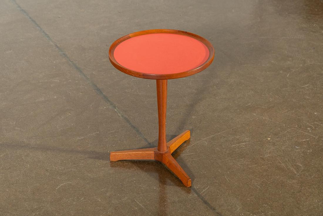 Hans Andersen Round Danish Teak Side Table: Mid-Century Modern side table designed by Hans C. Andersen. This piece has a orange laminate inlaid top and a solid teak pedestal base. CREATOR: Hans Andersen (Designer). OF THE PERIOD: Scandinavian M