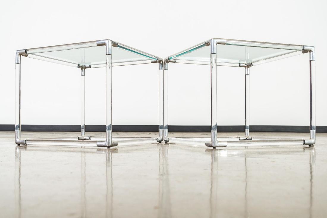 Pair of Lucite Glass Tables by Attr. Charles Hollis: Thick Lucite rods with cast aluminum joinery and original plate glass top Attr. Charles Hollis Jones. CONDITION: Good. Minor scratches on glass and acrylic. Acrylic has minor chip. Refer to photos for