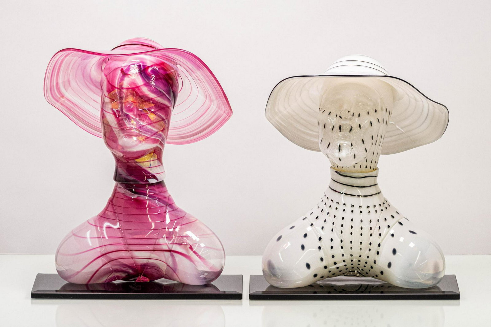 Set of Two (2) Kevin Fulton Art Glass Sculptures: Set of two (2) art glass sculptures of figures in sunhats, both signed "Kevin Fulton 1993" to base. ARTIST: Kevin Fulton CONDITION: Very good, white sculpture has been repaired with glue at neck; disc