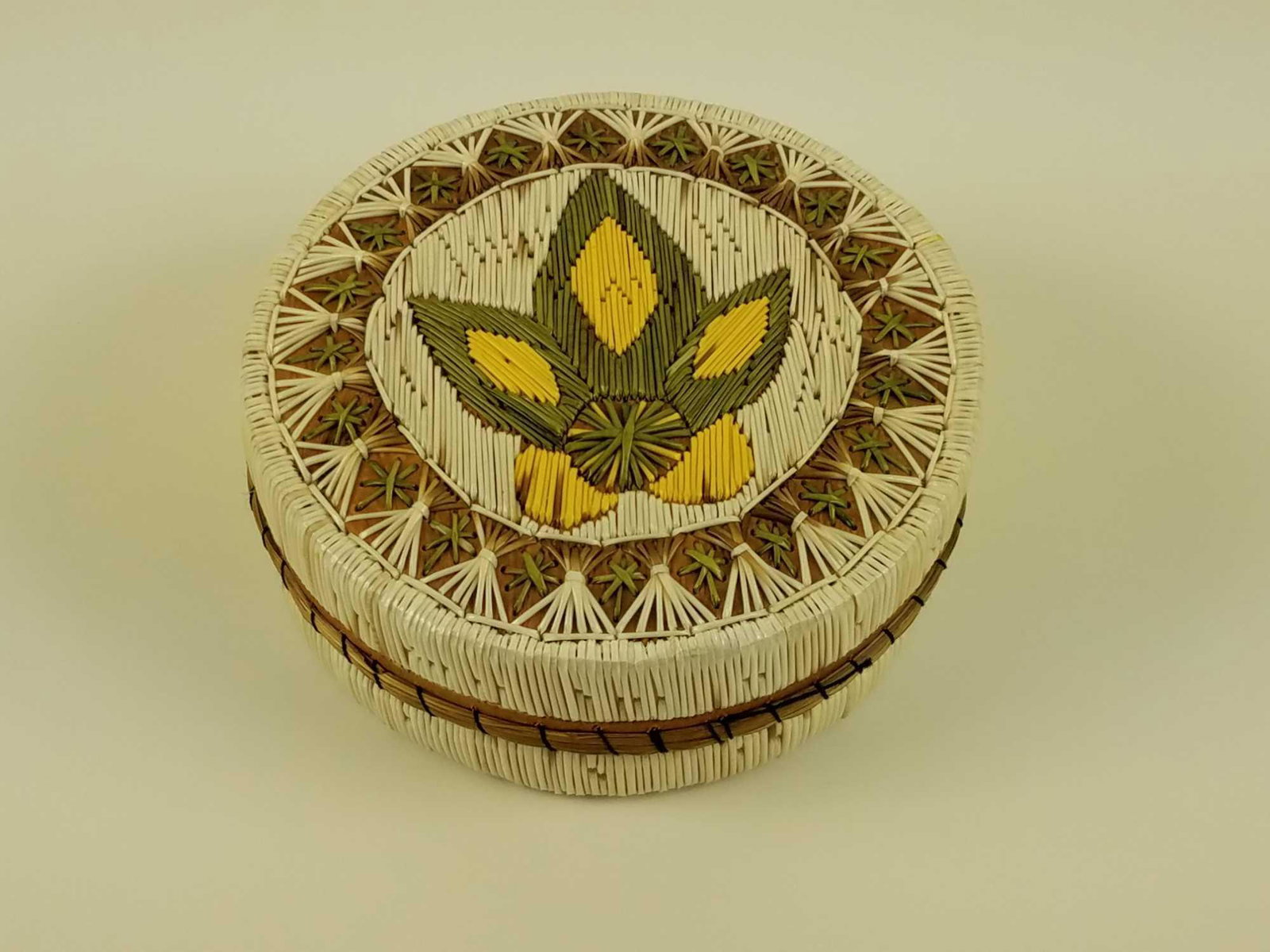 Native American Birch Bark and Porcupine Quills Trinket: This is a Native American round birch bark and dyed porcupine quill trinket box with a green and yellow flower design on the lid. MEASUREMENTS: 5" in diameter. 2" tall.