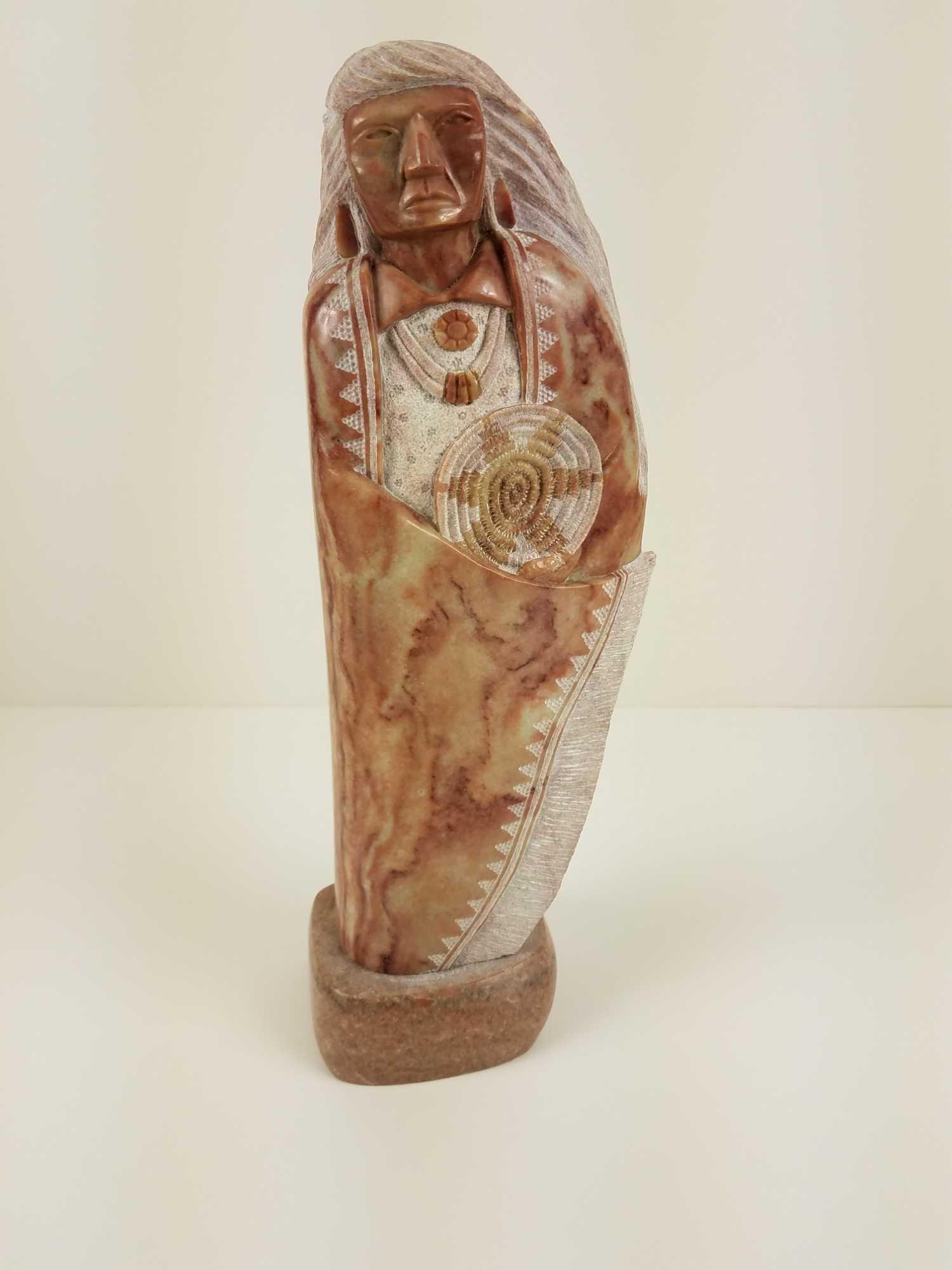 Signed Pettigrew Alabaster Native American Sculpture: Alabaster Native American sculpture, signed by Pettigrew. MEASUREMENTS: 14" x 4.5" x 3.5" CONDITION: good.