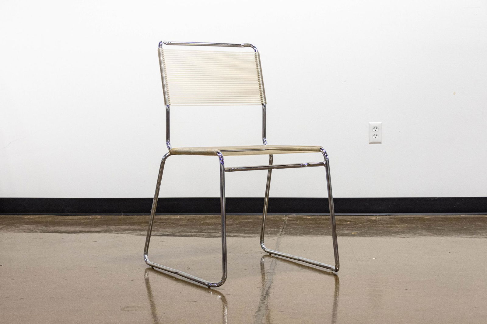 Walter Lamb Dining Chair: DescriptionChair with tubular chrome frame and clear vinyl straps on back and seat ARTIST: Walter Lamb CONDITION: Very good, signs of normal usage DIMENSIONS: 34.5" x 21.5" x 24"