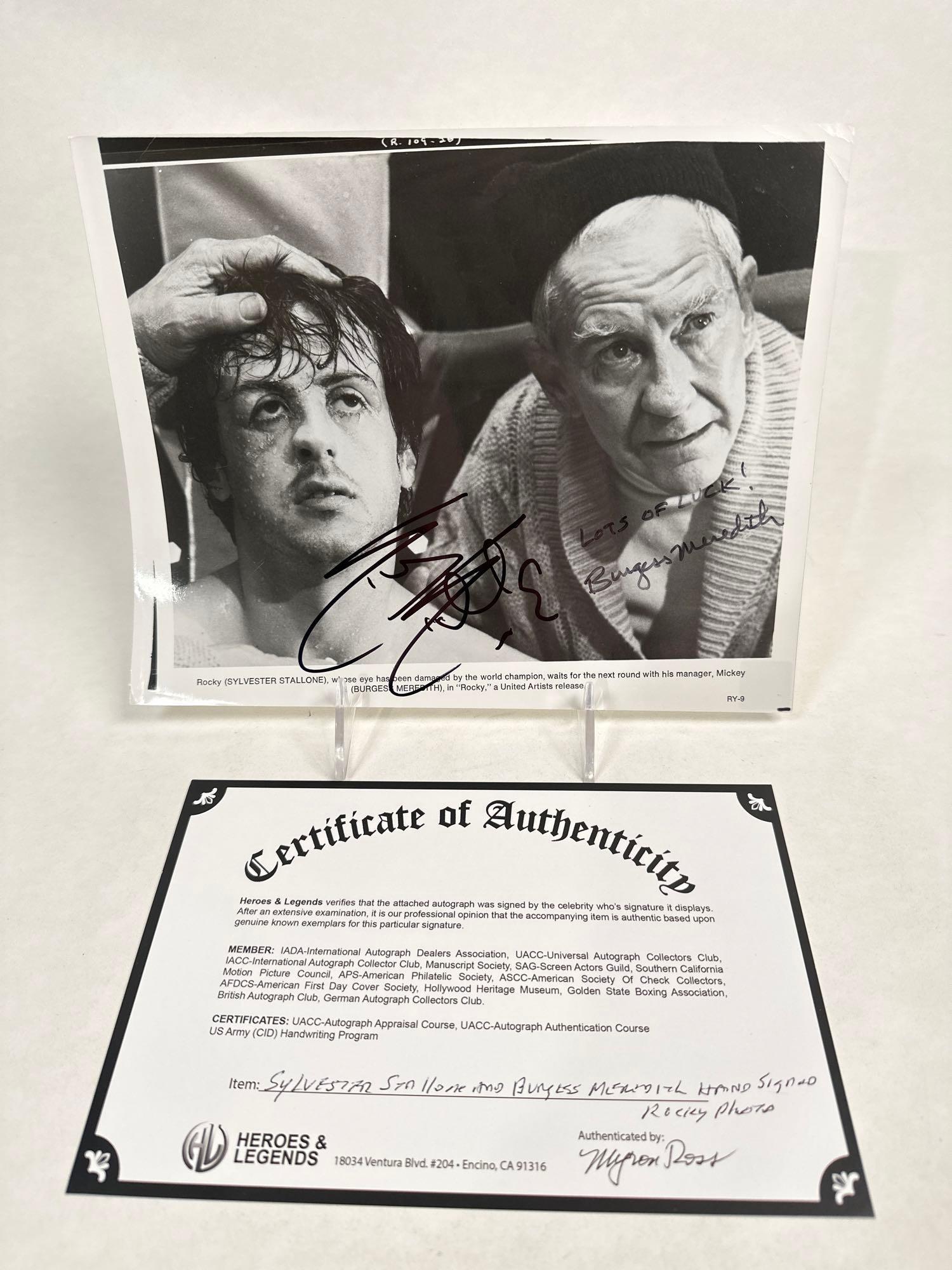 Sylvester Stallone and Burgess Meredith hand signed Rocky photo: Sylvester Stallone and Burgess Meredith hand signed Rocky photo 8”H x 11”W “Best of Luck!” Burgess Meredith. Rocky (Sylvester Stallone), whose eye has been damaged by the world