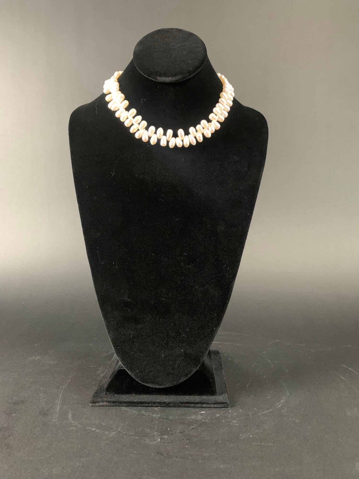 "Zipper Pearl" Baroque Choker: Freshwater "zipper pearl" choker necklace made with baroque pearls.. This piece has an open box silver clasp. Pearls are aprox 7mm to 8mm and the necklace is aprox 16" long. Piece is in go