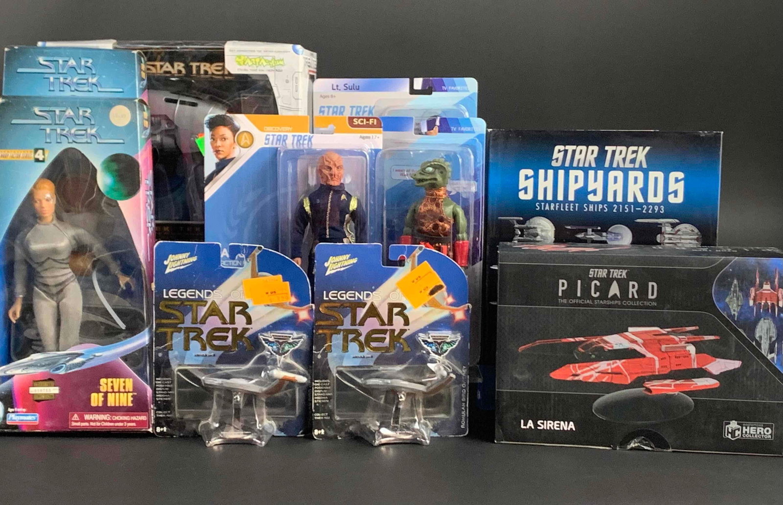 Large Lot of Star Trek Collectible Toys: Large Lot of Star Trek Collectible Toys. Lot includes Two Legends of Star Trek Series One Formulan Bird of Prey in original sealed box, Three Star Trek Classics 8" Figures (Lt. Sulu, Saru, and Gor