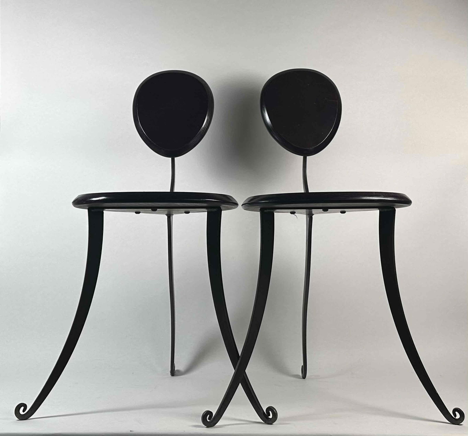 Pair of Post Modern Aubergine Chairs: Pair of Post Modern Chairs. Aubergine wood with curved metal legs. Chairs are in great condition. Please see photos for more details. Dimensions: 22" x 15" x 32"