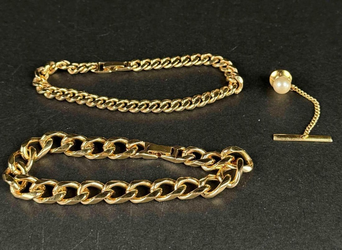2 Chain Link Bracelets and Cultured Pearl Tie Pin: 2 chain link bracelets and pearl tie pin. All items are in excellent condition. Please refer to photos for further details. Please note all lots show signs of wear commensurate with age and use, and