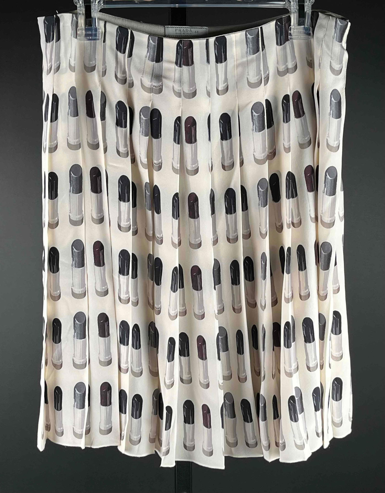 Prada "Lipstick" Pleated Skirt: Spring/Summer 2000 Prada lipstick pleated silk skirt made in Italy. In excellent vintage condition. Please see photos for additional details. Dimensions: Size 8 in US | Please note all lots show sig