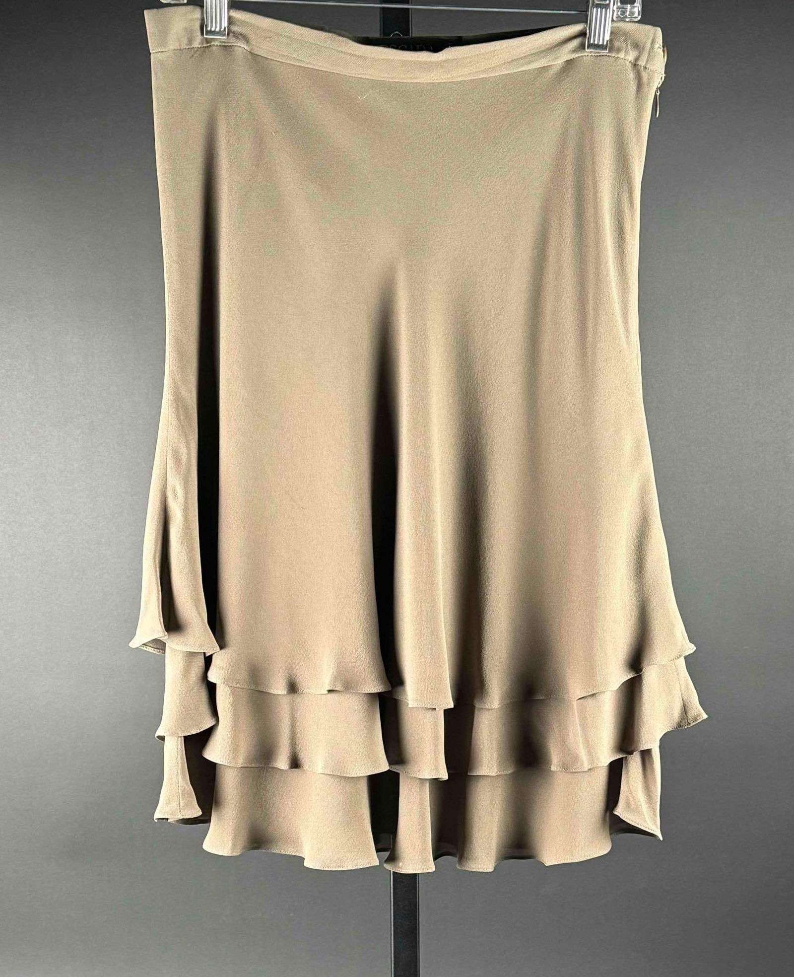 Escada Ruffle Skirt: Ruffle skirt from the brand " Escada " in tan. Fabric is 100% silk. Made in Germany. In excellent condition. Please see photos for additional details. Dimensions: Size 42 in DE; Size 12 in US